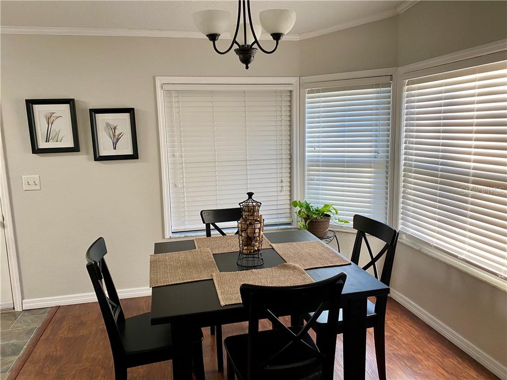 COMFORTABLE DINING ROOM WITH LOTS OF NATURAL LIGHT