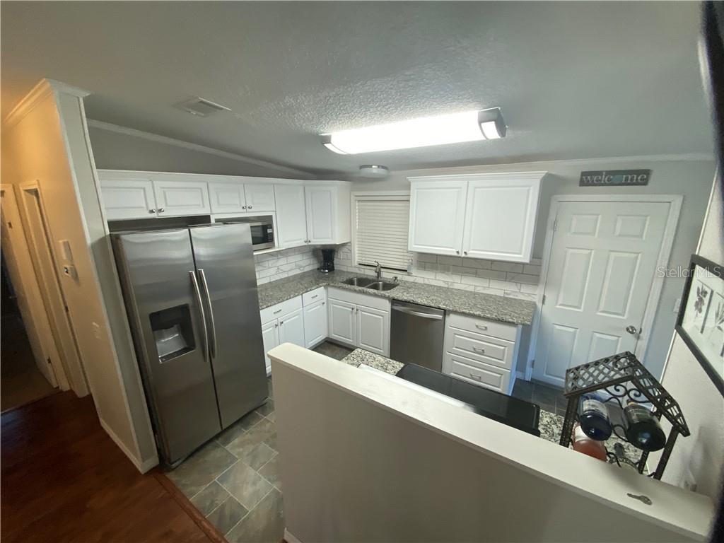 ALL NEW KITCHEN CABINETS, APPLIANCES, GRANITE COUNTERTOPS, UNDER CABINET SINK