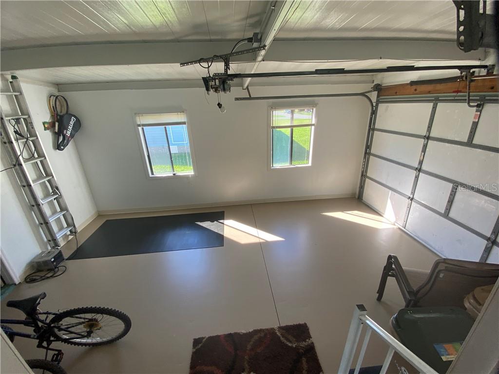THERE IS A PULL DOWN SCREEN ON THE GARAGE DOOR AS WELL