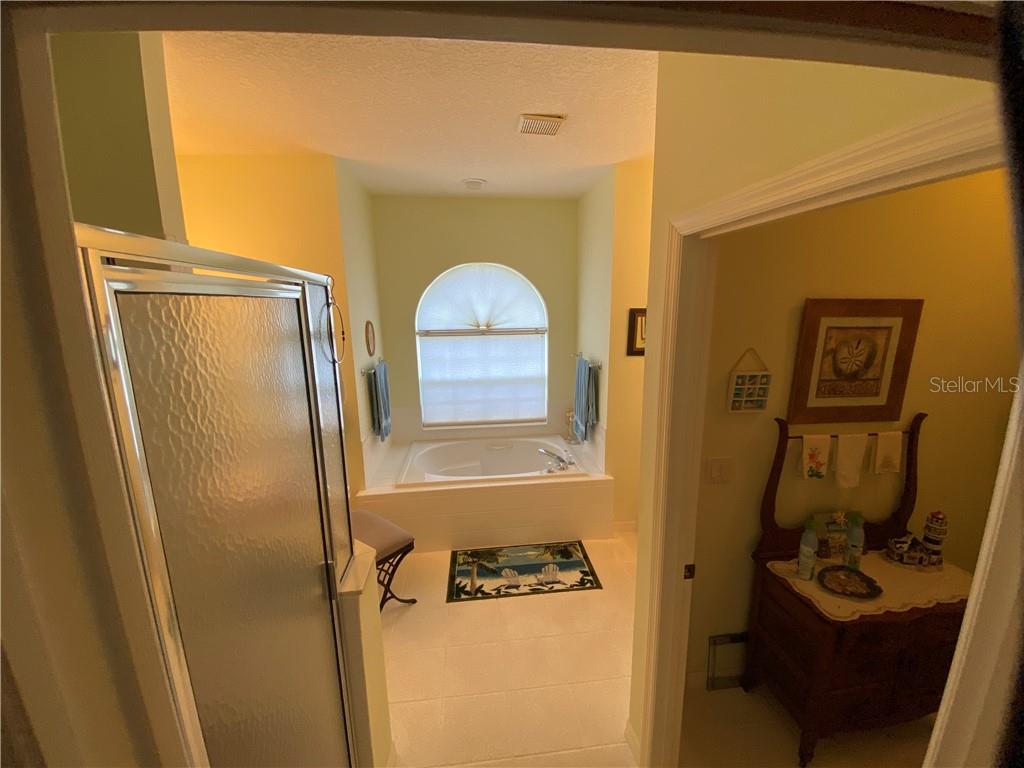 LARGE MASTER BEDROOM WITH SOAKING TUB, SEPARATE SHOWER, AND PRIVATE WATER CLOSET