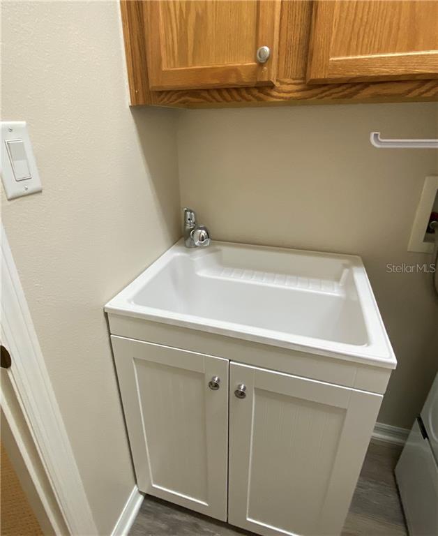 NEWER UTILITY SINK IN LAUNDRY
