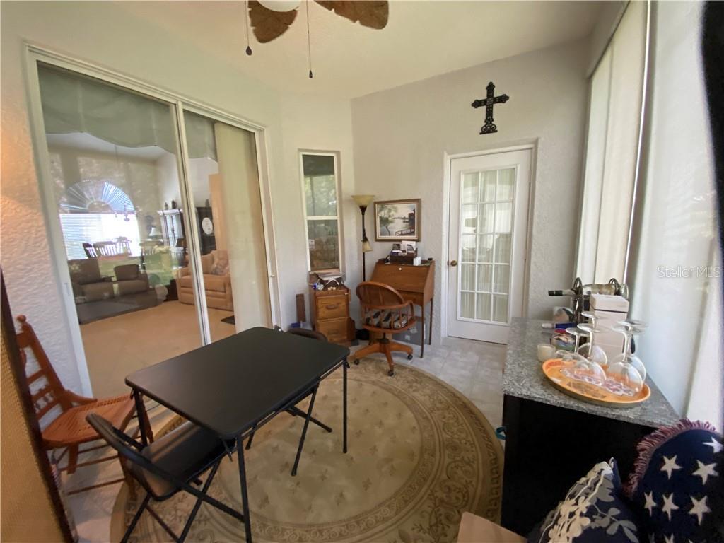 SLIDING DOORS GOING INTO LIVING ROOM AND MASTER BEDROOM AND FRENCH DOOR GOING INTO DINETTE FROM LANAI