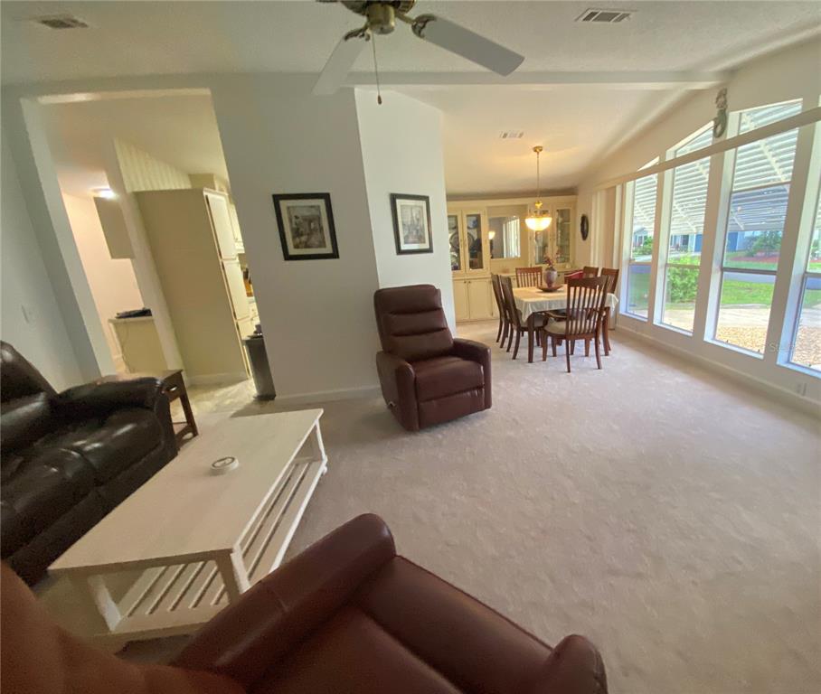 LIVING ROOM OPENS TO DINING ROOM