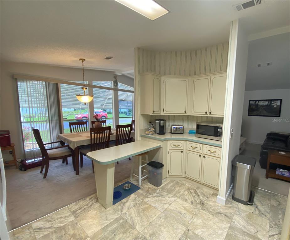 KITCHEN OPENS TO DINING ROOM AND HALLWAY LEADING TO LIVING ROOM