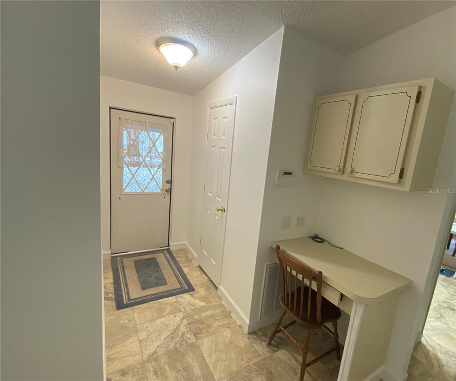 COMPUTER WORKSTATION IN AMPLE HALLWAY