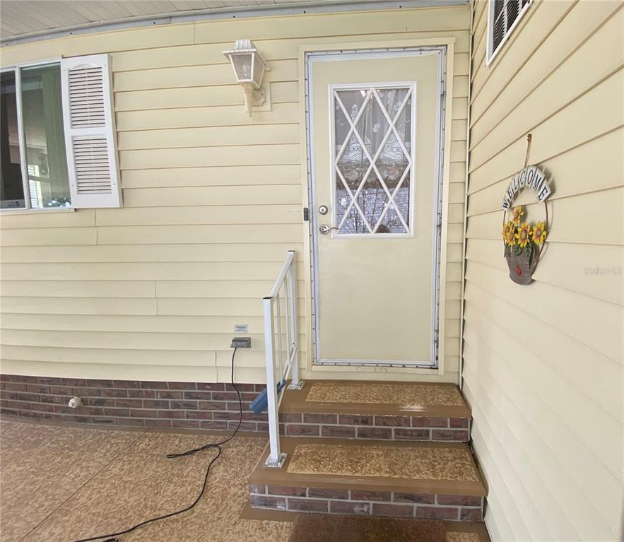 BACK ENTRANCE FROM CARPORT