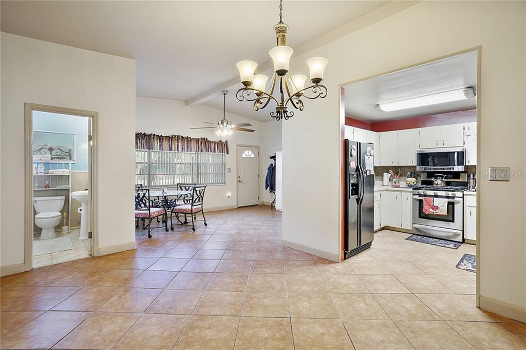 From Dining Room: Guest Bathroom left; front door center; Kitchen right