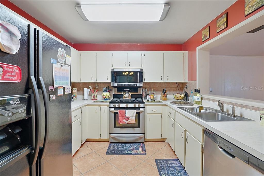 SS appliances including 5-burner gourmet stove.