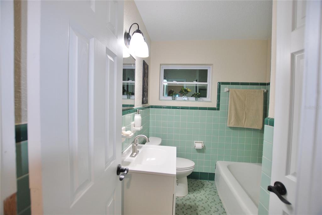 Bathroom with new vanity and toilet.