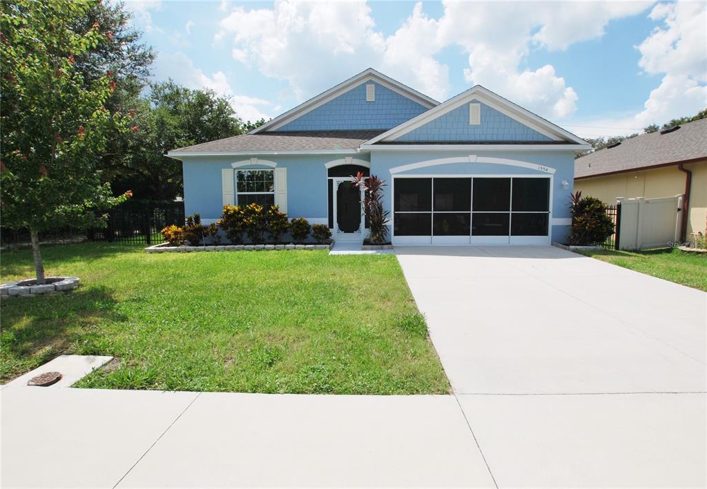 Nicely landscaped with an ample driveway leading up to the 2-car garage.