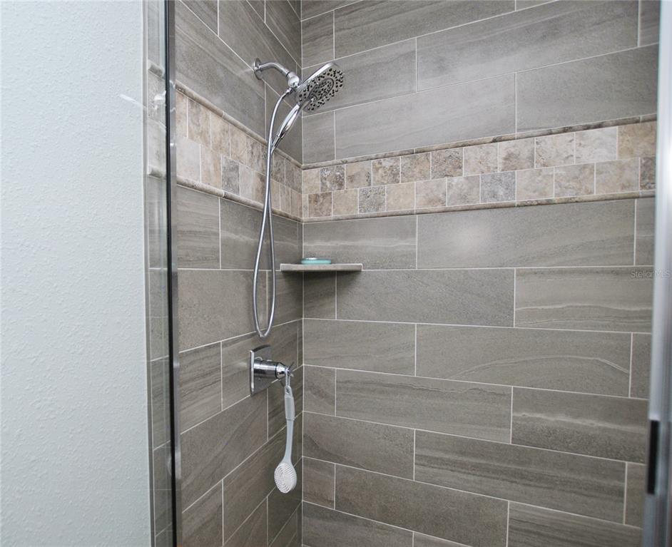 High-end faucets and beautiful marble and porcelain tiles in Bath.