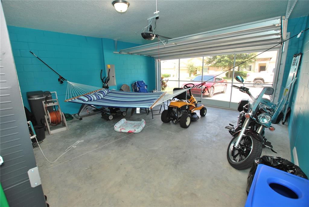 Screened doors in garage to keep the skeeters out. Garage large enough to use as another room in the house!