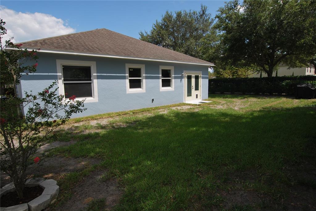Large back yard, fenced-in for privacy.