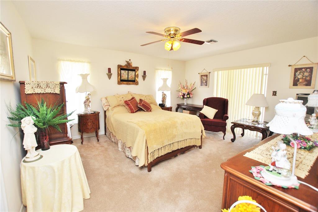 Large Master bedroom with double sliding doors to the lanai and En-Suite Master bath.