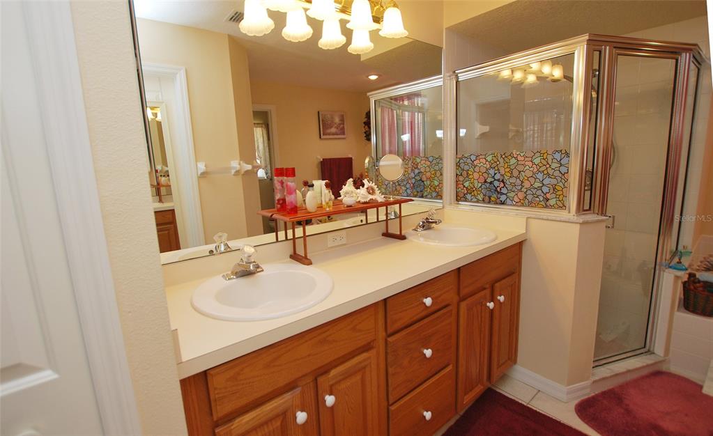 En-Suite Master Bath with double vanities and walk-in shower.