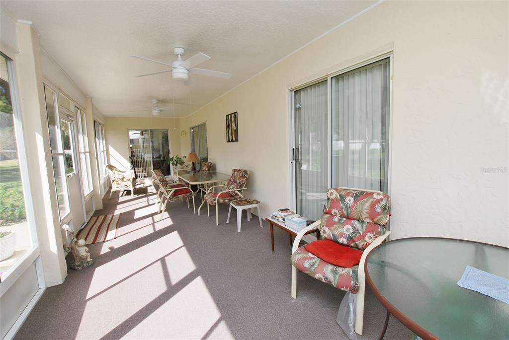 Large enclosed lanai has access from the eat-in area, living room, and Master bedroom.