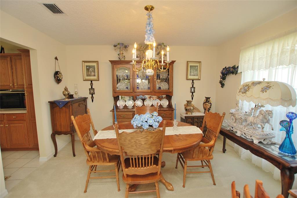 Formal dining room to the right of the foyer with access to the kitchen.