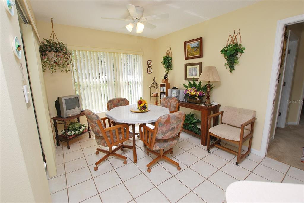 Breakfast-nook, eat-in area open to kitchen and living room.