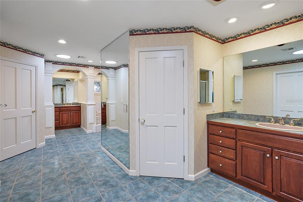 Master Bath with two water closets, two vanities, two large closets.