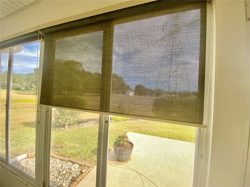 CUSTOM WINDOW BLINDS IN LANAI KEEP SUN OUT WITHOUT BLOCKING YOUR GORGEOUS GOLF COURSE VIEW