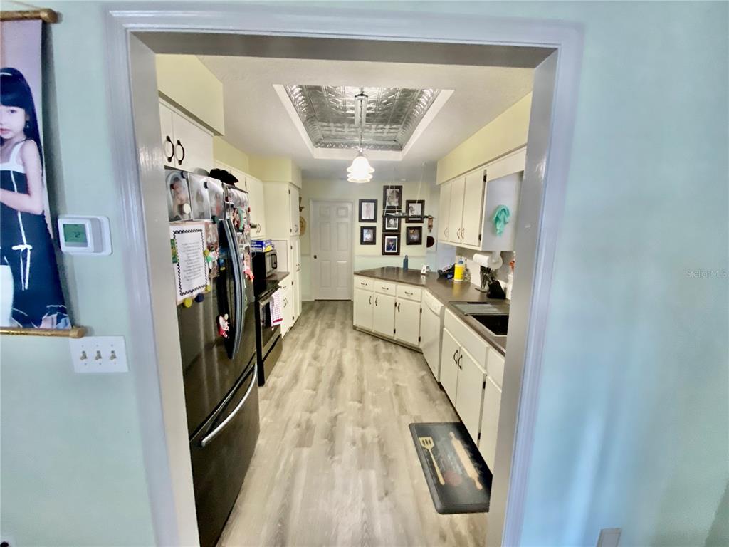 FRENCH DOORS OFF DINETTE AREA GOING INTO LANAI