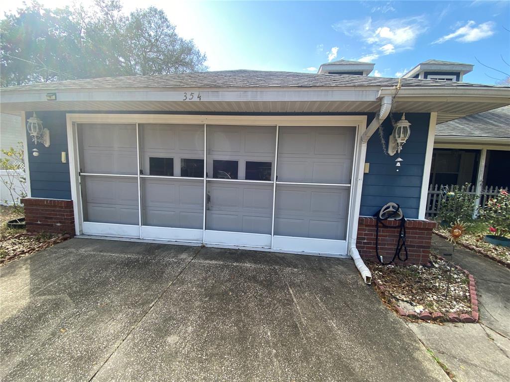 SCREEN DOOR ON GARAGE FOR NICE SUMMER BREEZES
