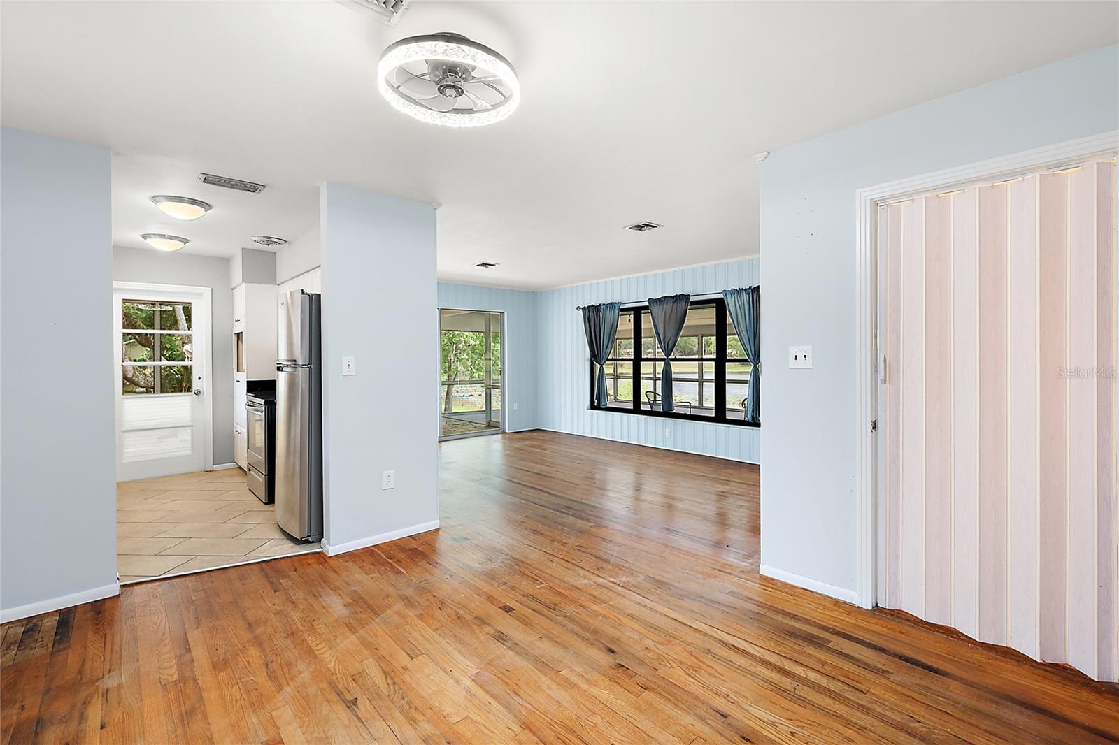 living room, Stairwell through accordian door to right.