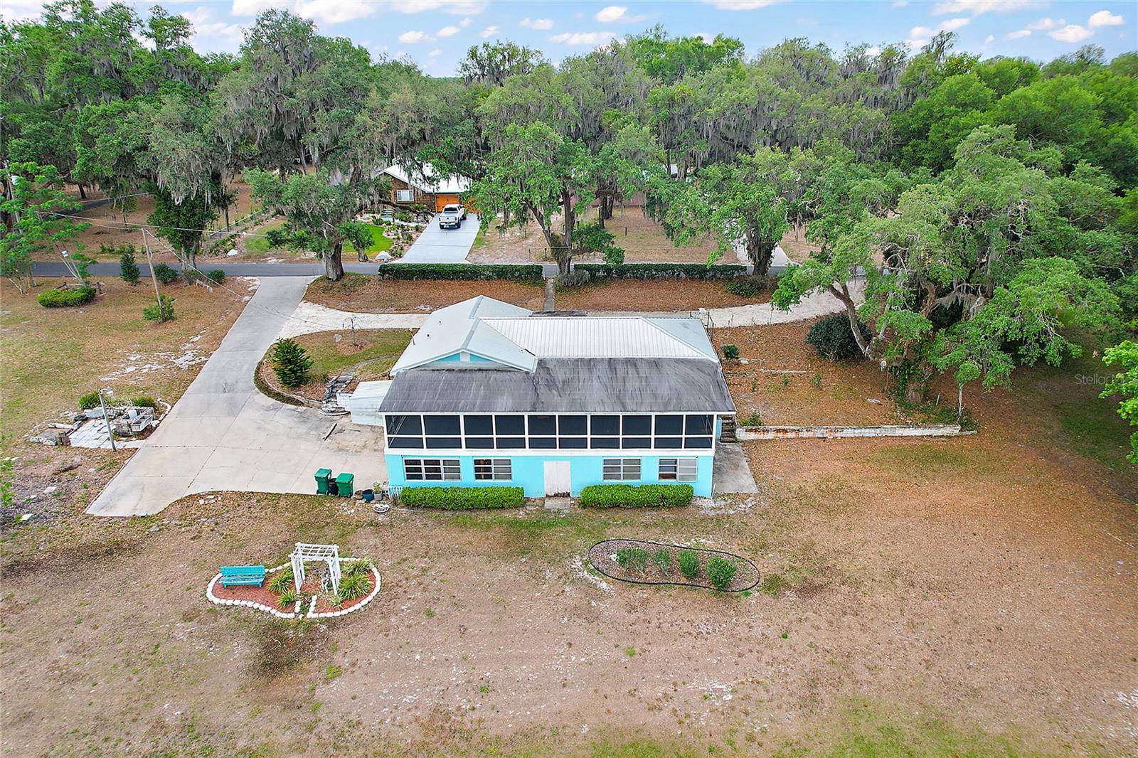 Circular Drive way (Rock) Paved drive and side parking leading to garage
