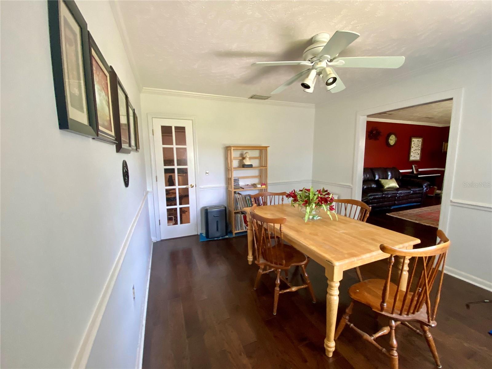 DINING ROOM CHAIR RAILING, CROWN MOLDING, AND ENGINEERED HARDWOOD FLOORS