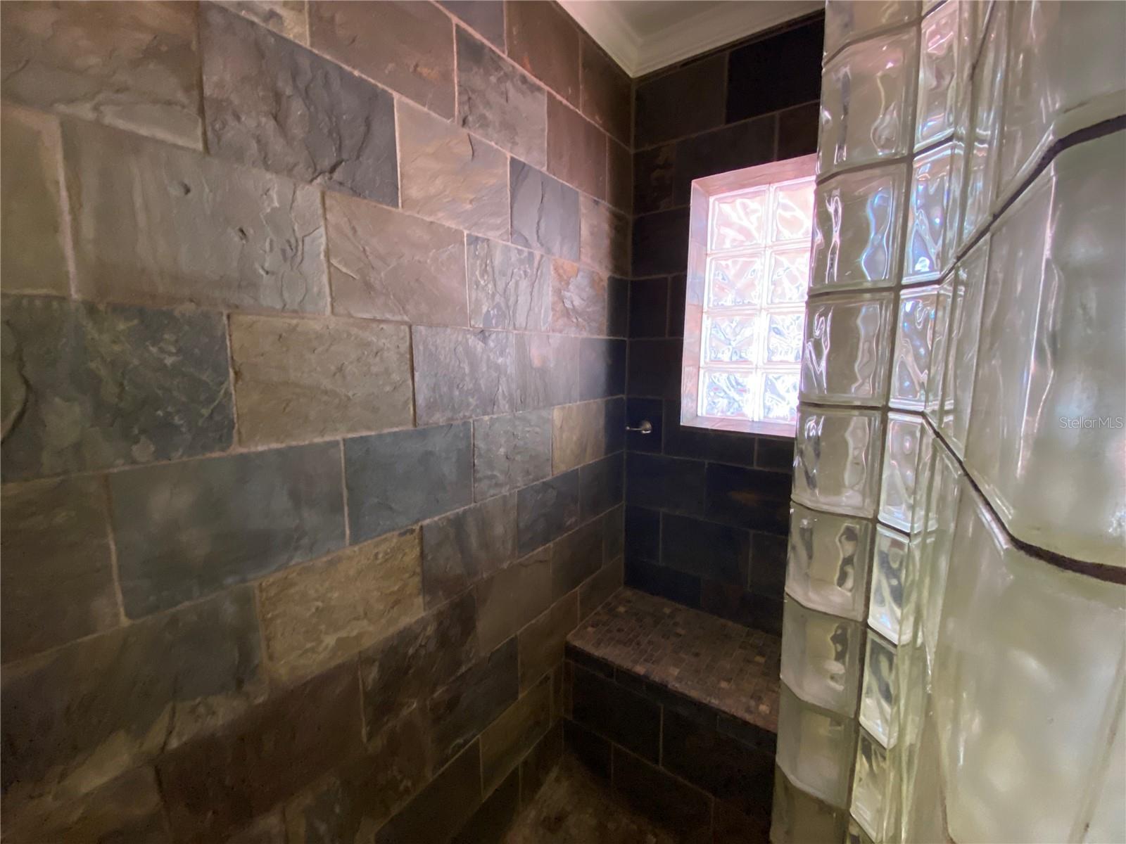 LARGE SLATE TILED SHOWER WITH BUILT IN SEAT