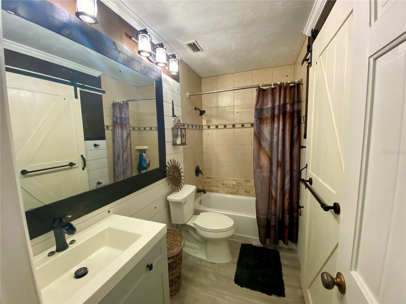 ONE OF THREE FULL BATHS