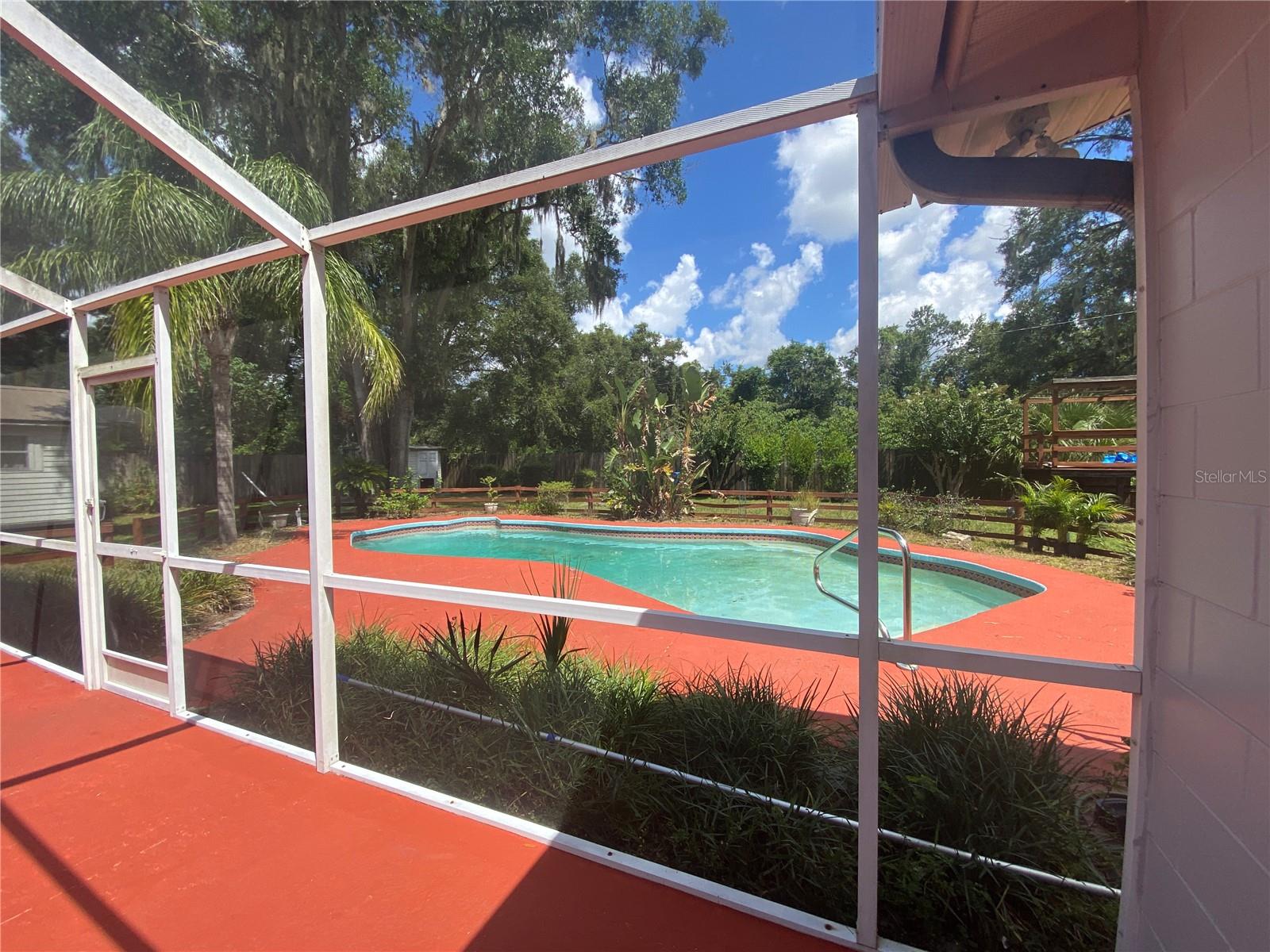 LOOKING OUT TO POOL AREA