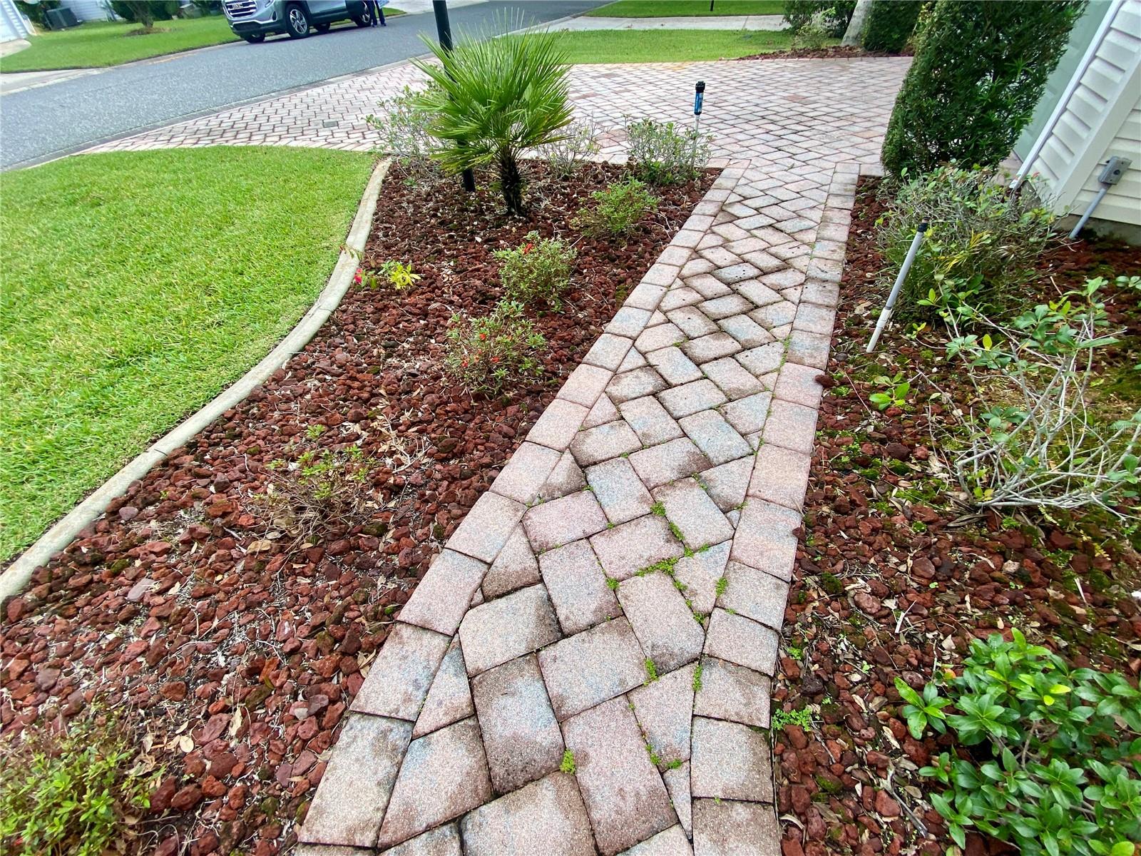 PAVERS IN DRIVEWAY, REAR PATIO, SIDEWALK