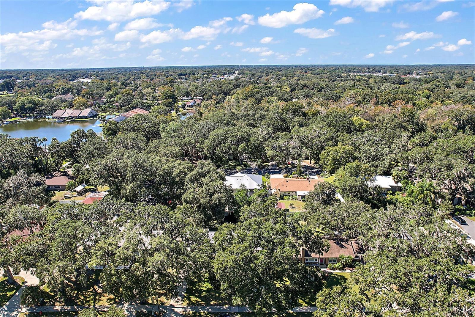 Aerial view behind the home. 9th St. Canal/Lagoon in the distance