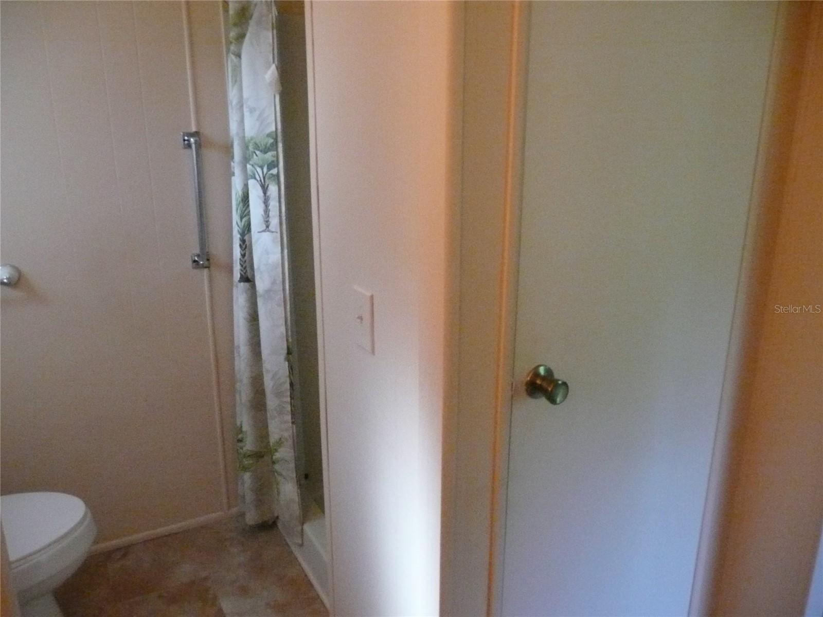 Ensuite Bathroom with Walk-in Shower and Linen Closets