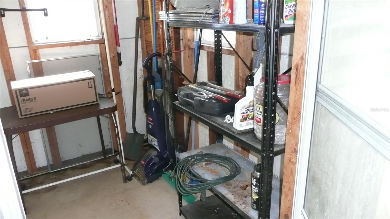 Let's walk into the Laundry Room at end of Carport