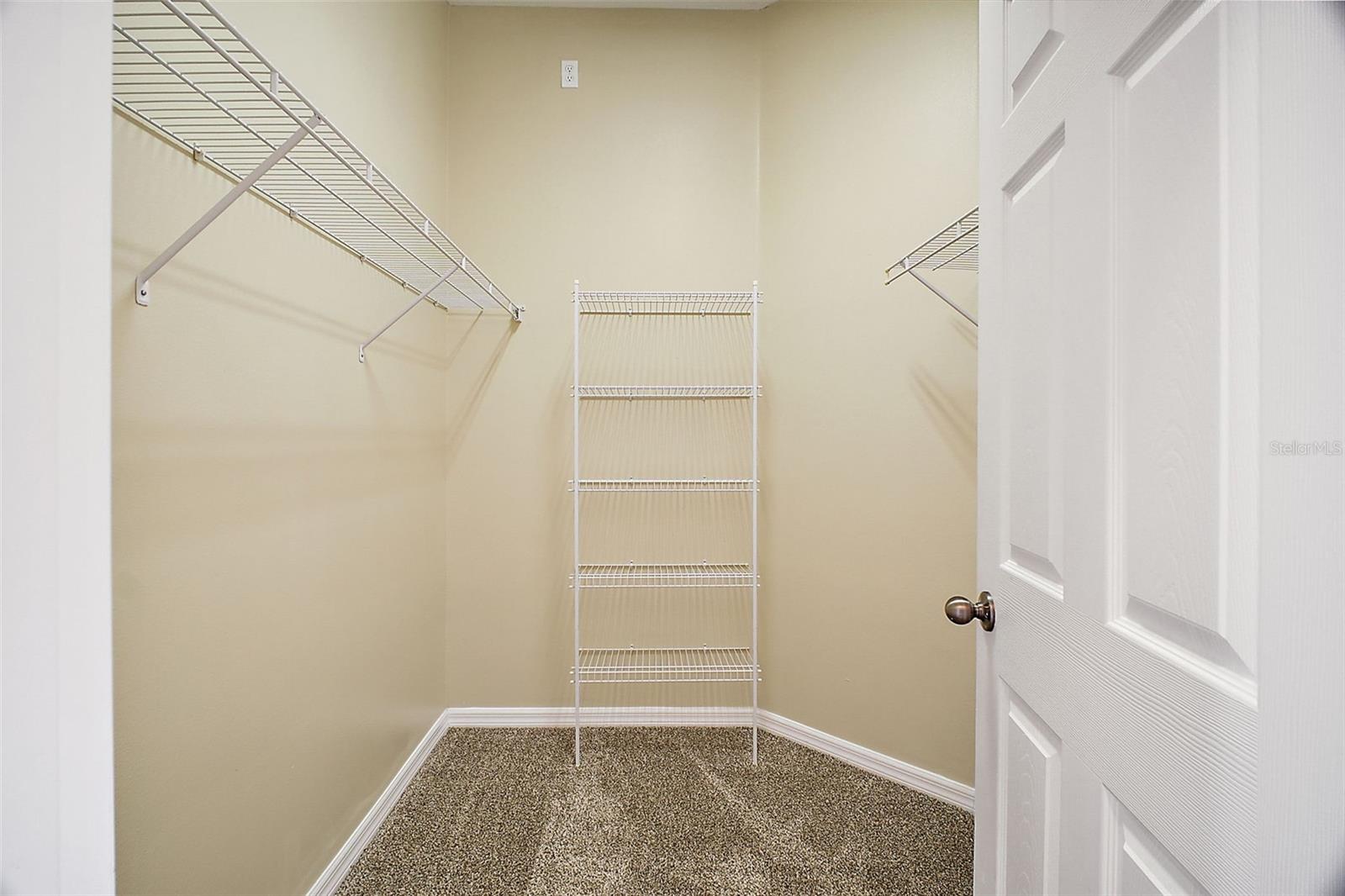 primary bedroom walk in closet 1