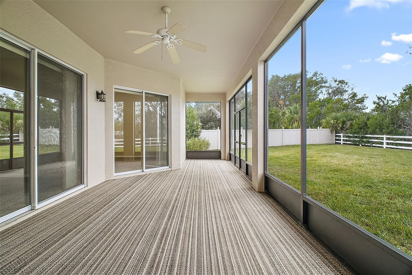 screened and carpeted back porch, overlooks large backyard