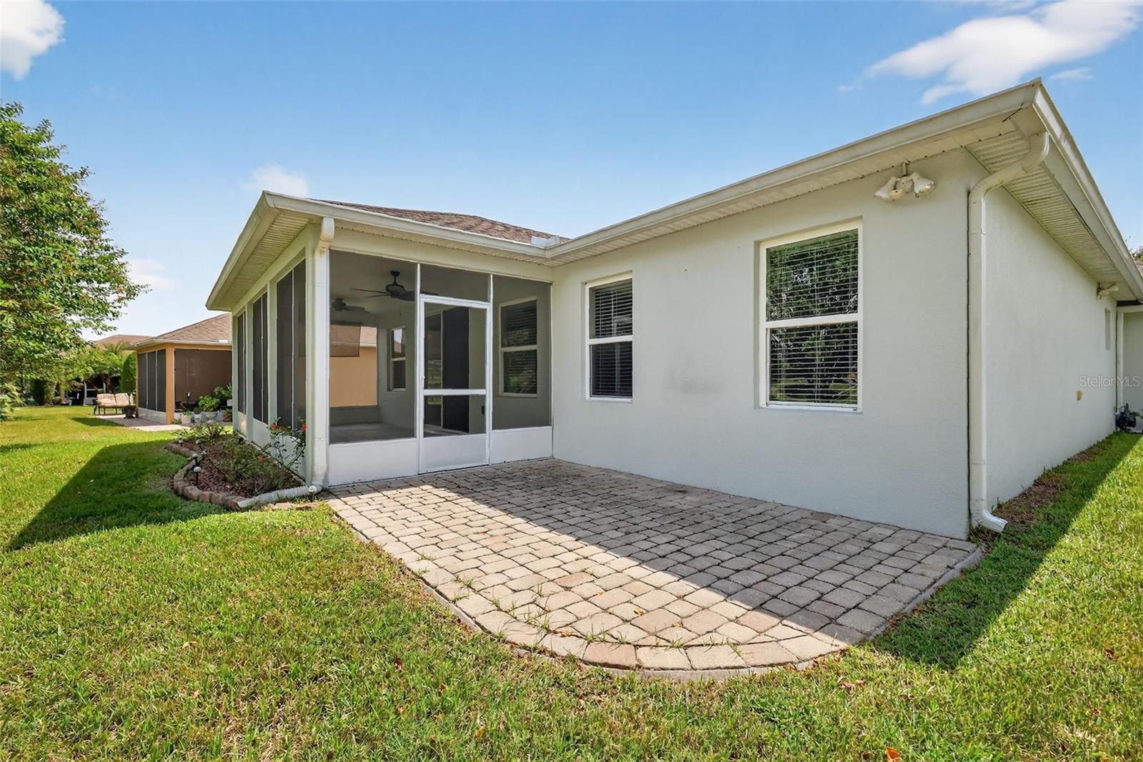 Back View showing sceened lanai and outdoor patio